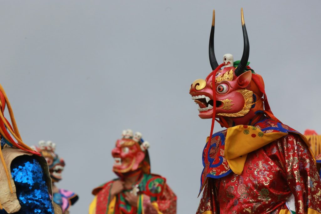Masked dancers at a Bhutanese tshechu festival