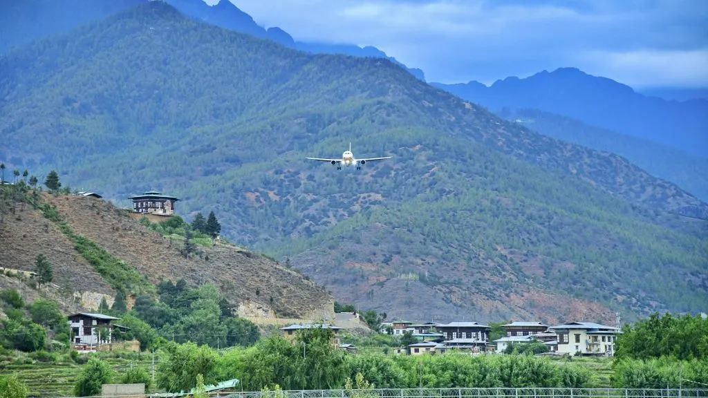A plane flying over the Paro valley