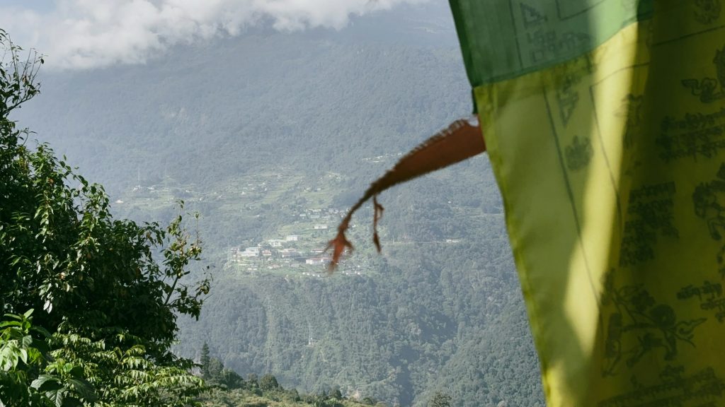 Prayer flags above a Bhutanese mountain village