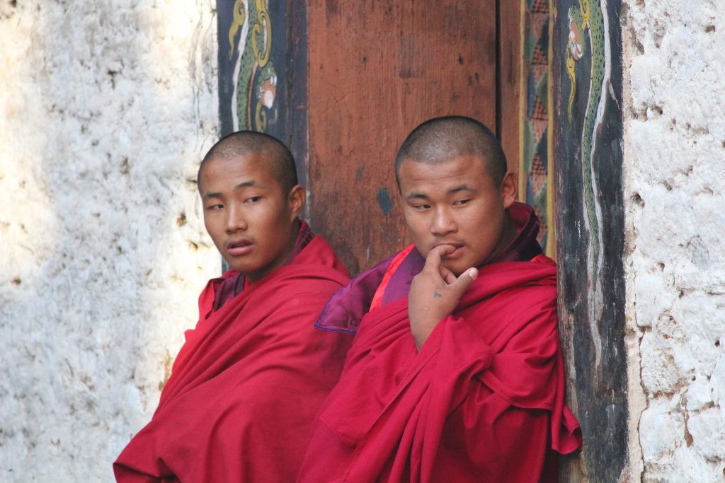 Monks at Trashigang Dzong watching festival rehearsals